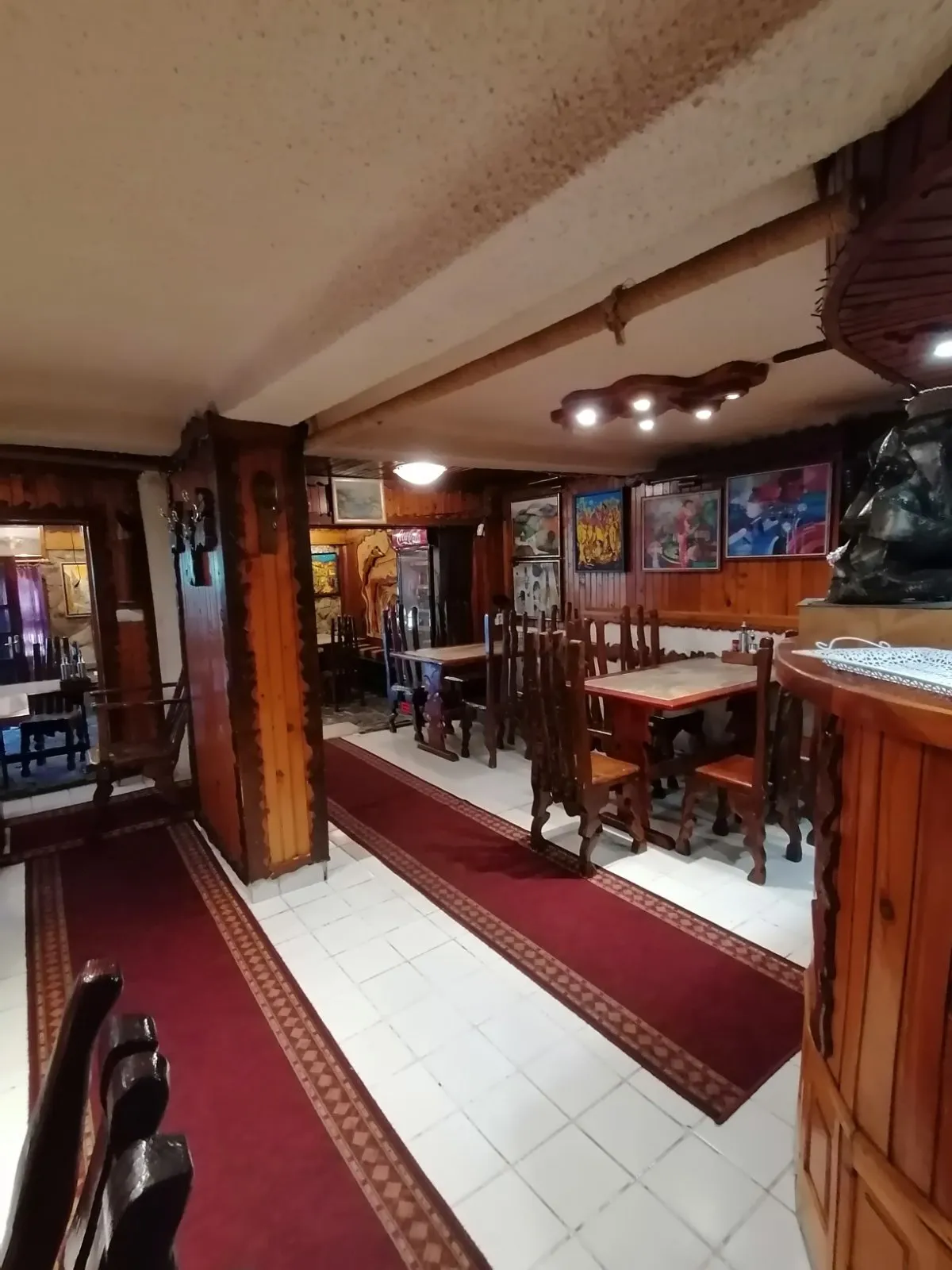 The paintings and the carved wood in the tavern