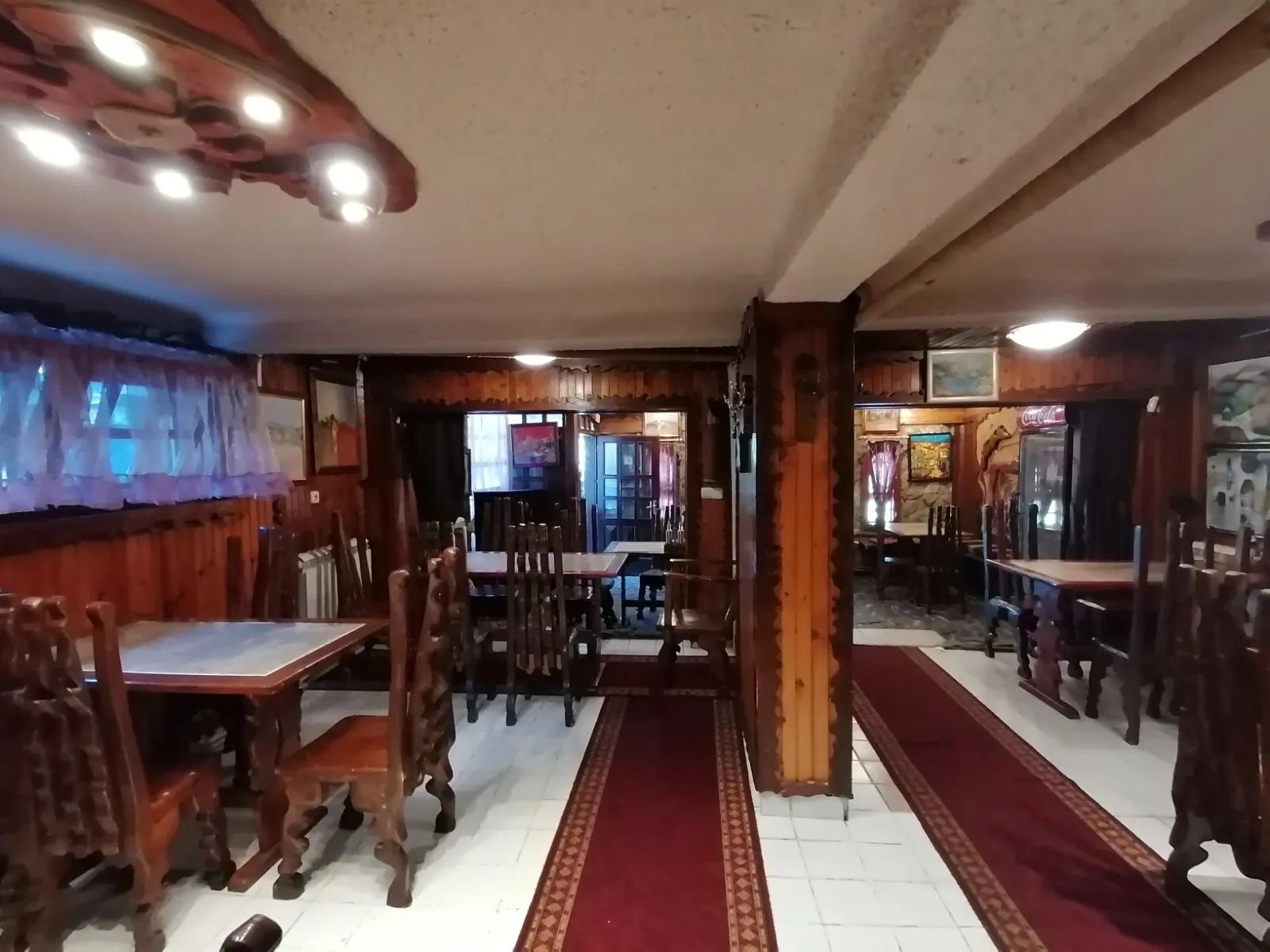 The rooms of the tavern with the red runners